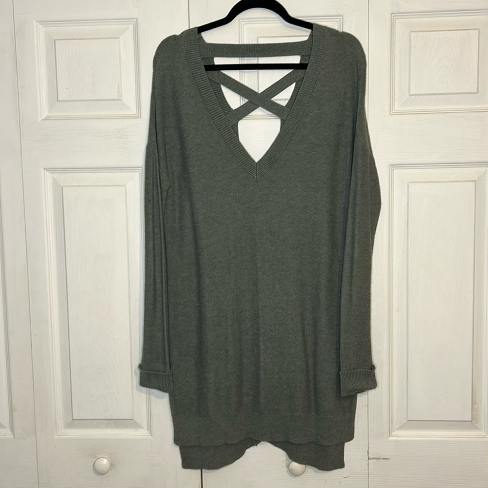 Size Medium Long Sweater. Low cut criss crossed back